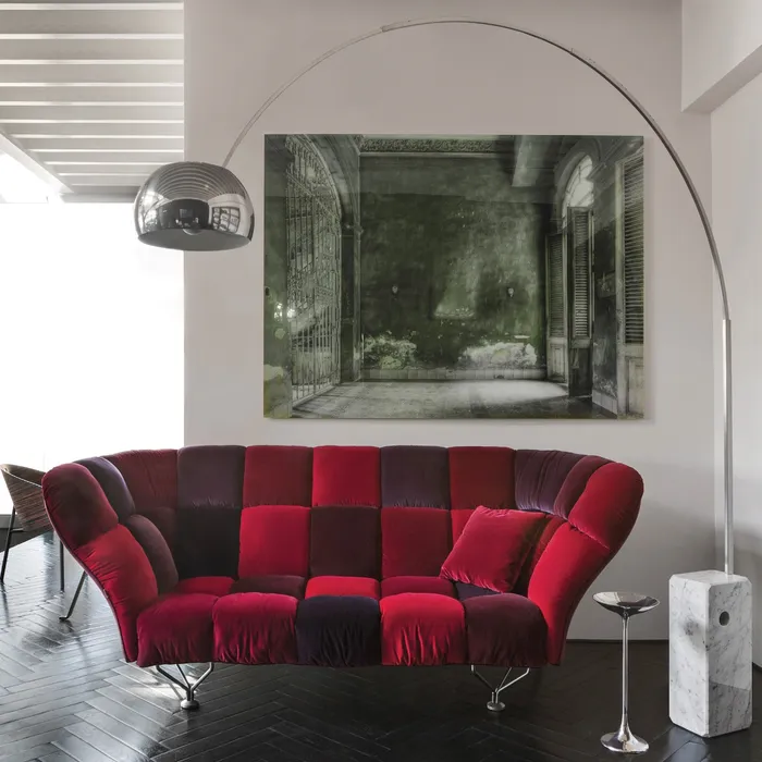 “33 Cuscini Sofa by Driade – contemporary sofa with 33 soft grey velvet cushions arranged in a grid pattern, set on a sleek black steel base, designed by Paolo Rizzatto, combining minimalist design with luxurious comfort.”