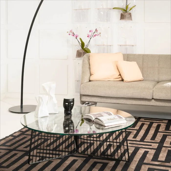 “Close-up of ANAPO table by Driade – refined Italian craftsmanship featuring a transparent surface and bold geometric structure”
