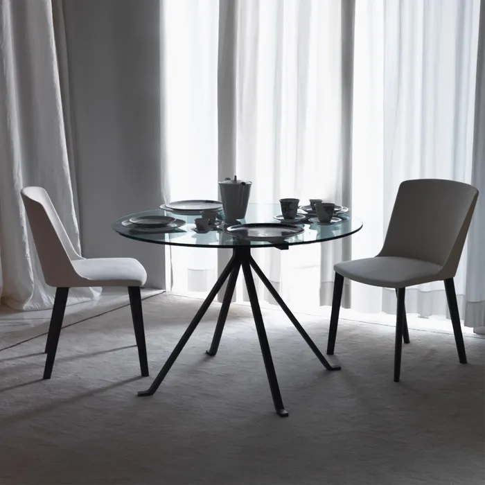 “CUGINO by Driade modern Italian designer chair – sleek metal frame with minimalist design and comfortable seating”