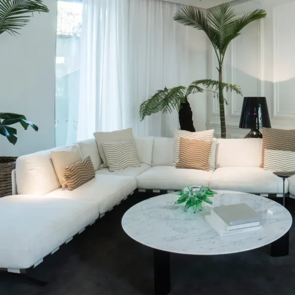 “Fenix Modular Sofa by Driade – versatile sectional sofa with asymmetric peninsula, tubular steel base, and plush cushions in fabric or leather, designed by Ludovica and Roberto Palomba, combining modern design with functional seating.”