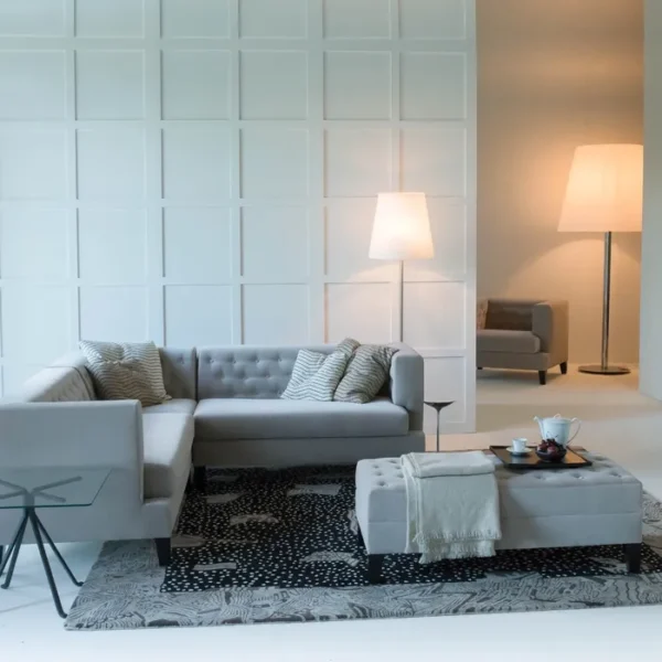 “Hall Armchair by Driade – elegant lounge chair with beige fabric upholstery, classic tufted detailing, and tapered wooden legs, designed by Rodolfo Dordoni, combining traditional English club aesthetics with minimalist Italian design.”