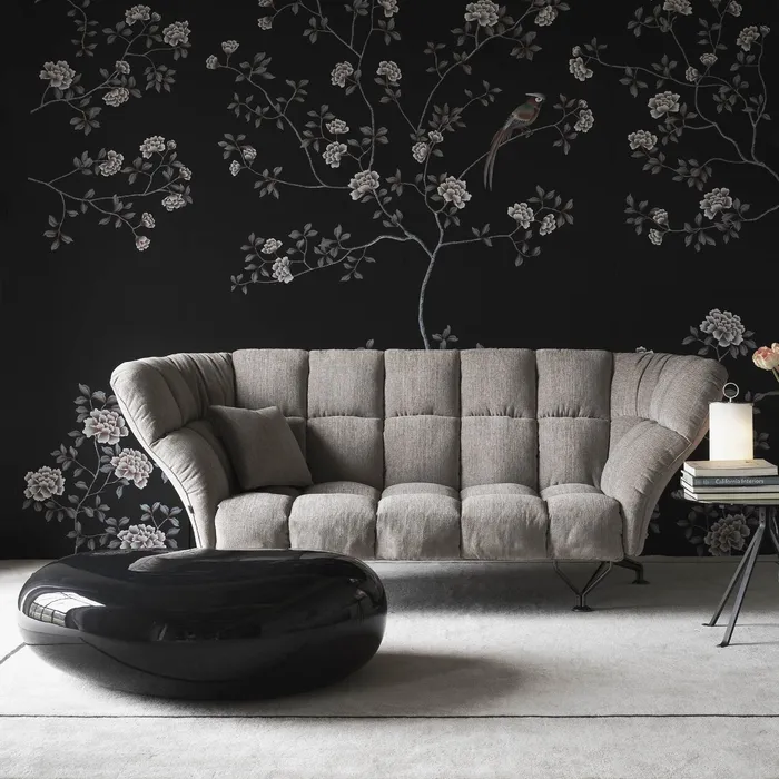 “33 Cuscini Sofa by Driade – contemporary sofa with 33 soft grey velvet cushions arranged in a grid pattern, set on a sleek black steel base, designed by Paolo Rizzatto, combining minimalist design with luxurious comfort.”