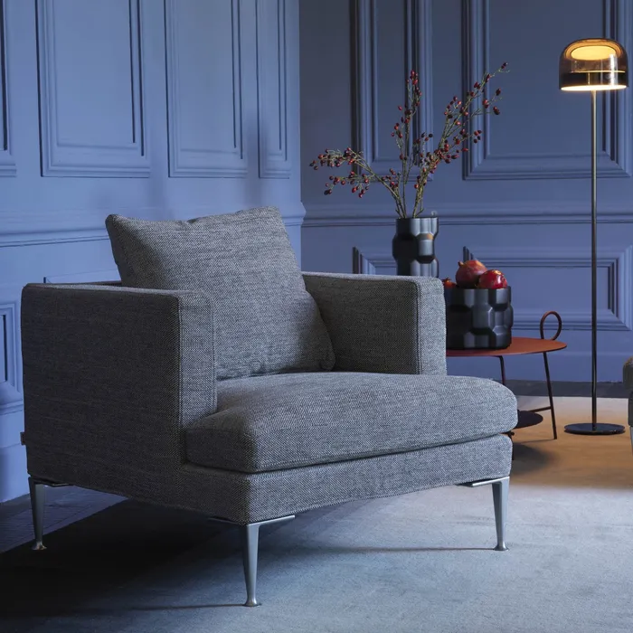 “LIRICA by Driade armchair – modern Italian design with suspended wooden frame and cast aluminum feet”