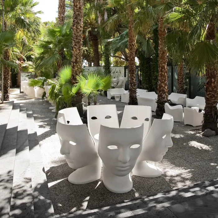 “Nemo Armchair by Driade – minimalist black polyethylene chair with classic facial features, offering a unique blend of art and functionality for contemporary spaces.”