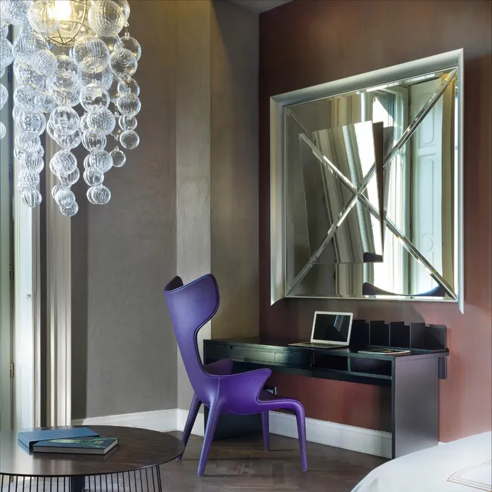 “Contemporary Osmond chair by Driade featuring elegant curves and refined Italian craftsmanship”