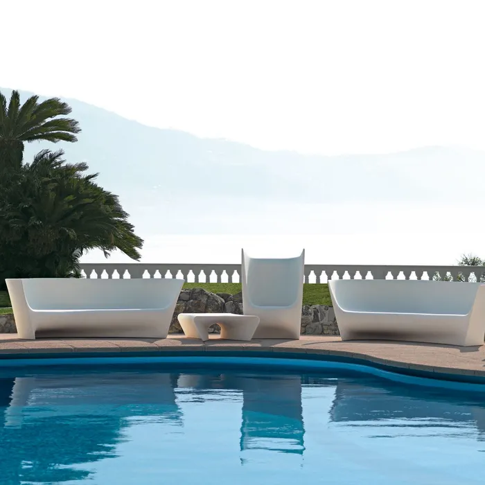 “Plie Armchair by Driade – versatile outdoor seating in white, designed by Ludovica and Roberto Palomba, offering sculptural comfort for garden and poolside environments.”