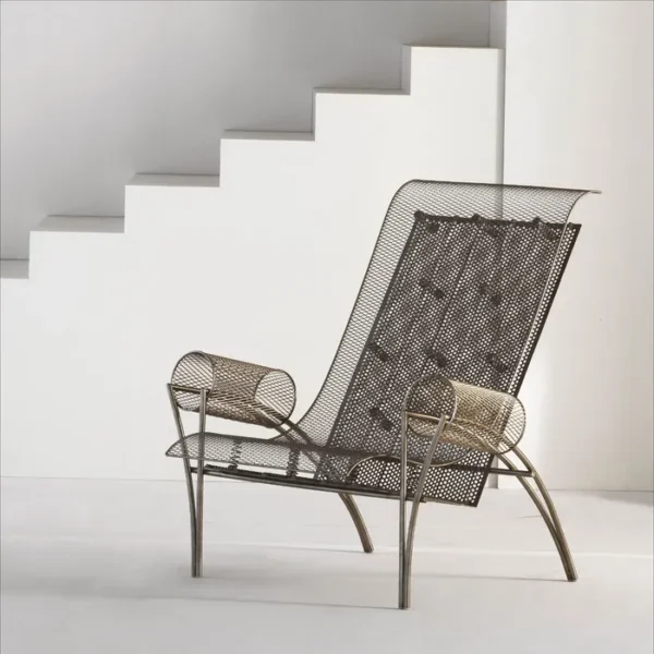 “Suki Armchair by Driade – contemporary lounge chair with a stainless steel mesh structure, designed by Toyo Ito, adding an architectural focal point to modern living spaces.”