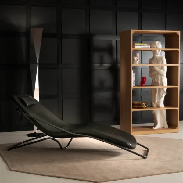 “Wireflow Chaise Longue by Driade – modern lounge chair featuring a flexible polyurethane shell with black leather cover and an adjustable headrest cushion, designed by Michel Rojkind, combining sculptural aesthetics with functional comfort.”