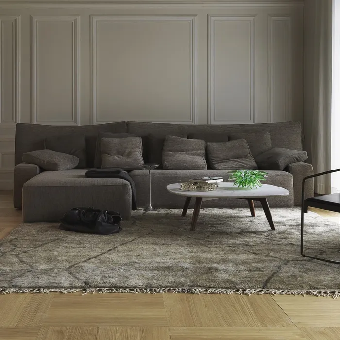 “WOW by Driade sectional sofa – versatile configuration featuring low backrest and brushed stainless steel side tables with LED lighting”