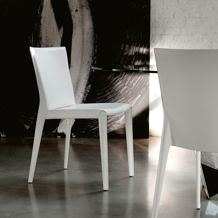 Close-up of Beverly chair by Cattelan – soft leather seat and streamlined steel legs