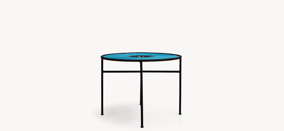 Banjooli chair by Moroso with handwoven multicolor cords and sculptural metal legs.