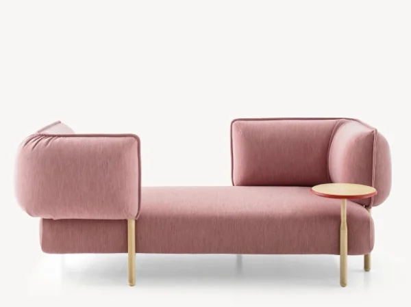 ender by Moroso featuring a sculptural design with plush, curved upholstery and a sleek, metal base.