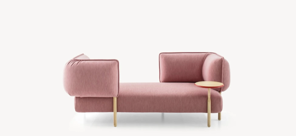 ender by Moroso featuring a sculptural design with plush, curved upholstery and a sleek, metal base.