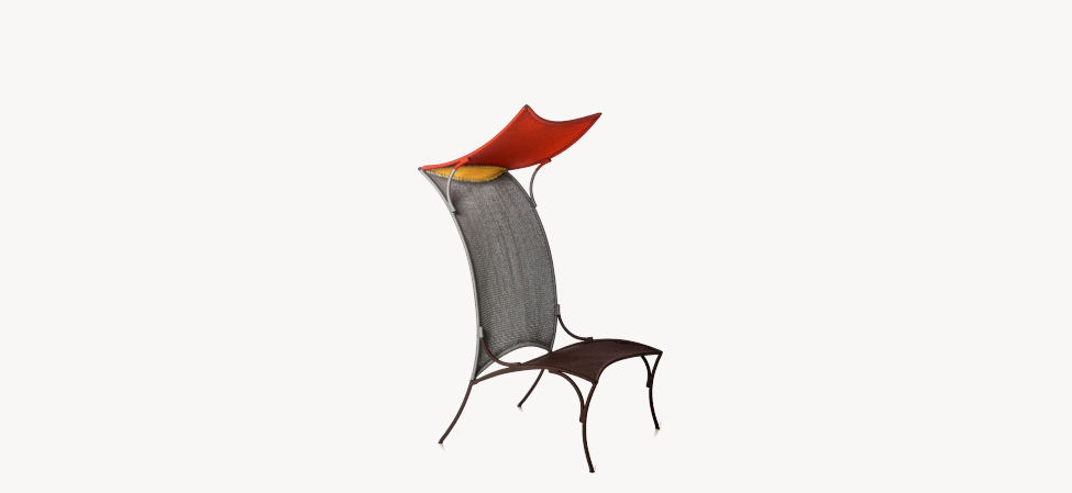 Arch by Moroso armchair in bold mustard yellow, styled in a contemporary studio apartment with concrete floors
