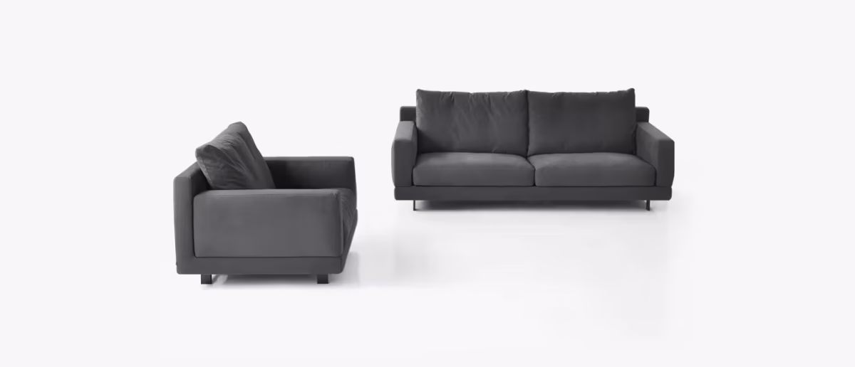 Elle by Bensen lounge chair in light beige fabric with fluid curves and slim metal base in a contemporary living space