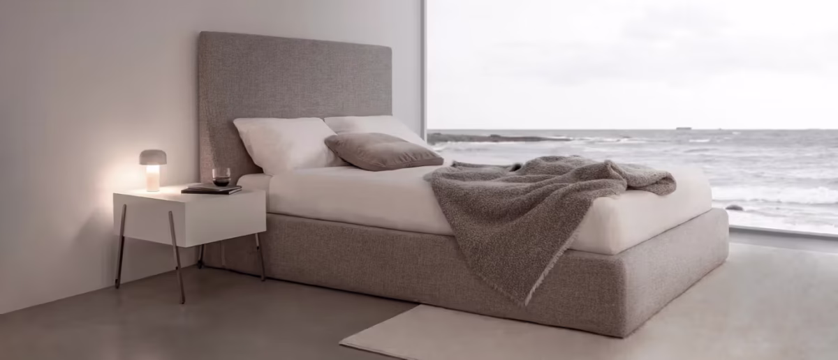 Everest by Bensen sectional sofa in light gray fabric with deep cushions and wide armrests in a modern living room