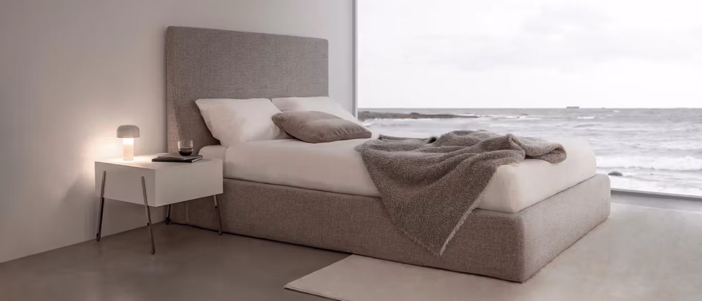 Everest by Bensen sectional sofa in light gray fabric with deep cushions and wide armrests in a modern living room