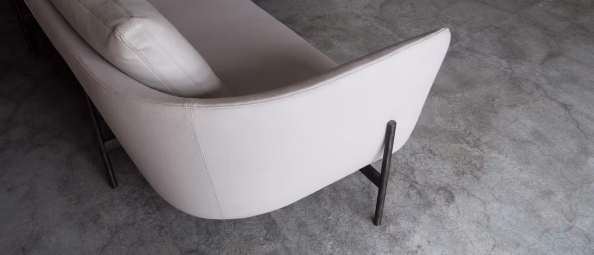 Loft by Bensen lounge chair in light gray fabric with clean lines and slim black metal legs in a contemporary living room
