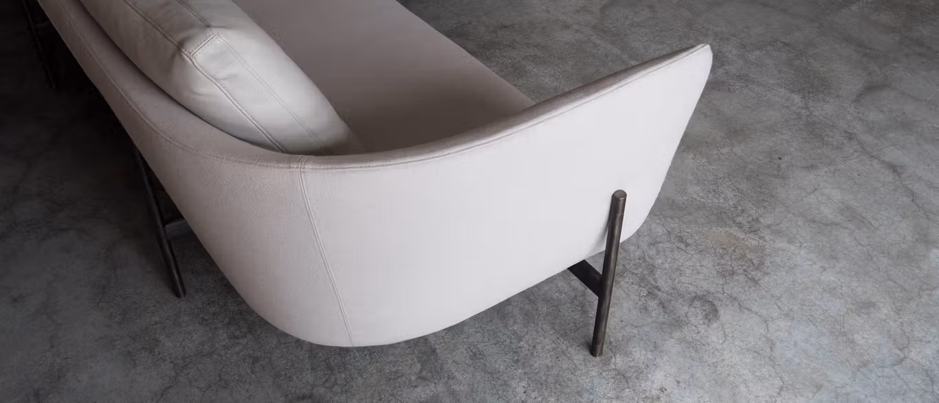 Loft by Bensen lounge chair in light gray fabric with clean lines and slim black metal legs in a contemporary living room