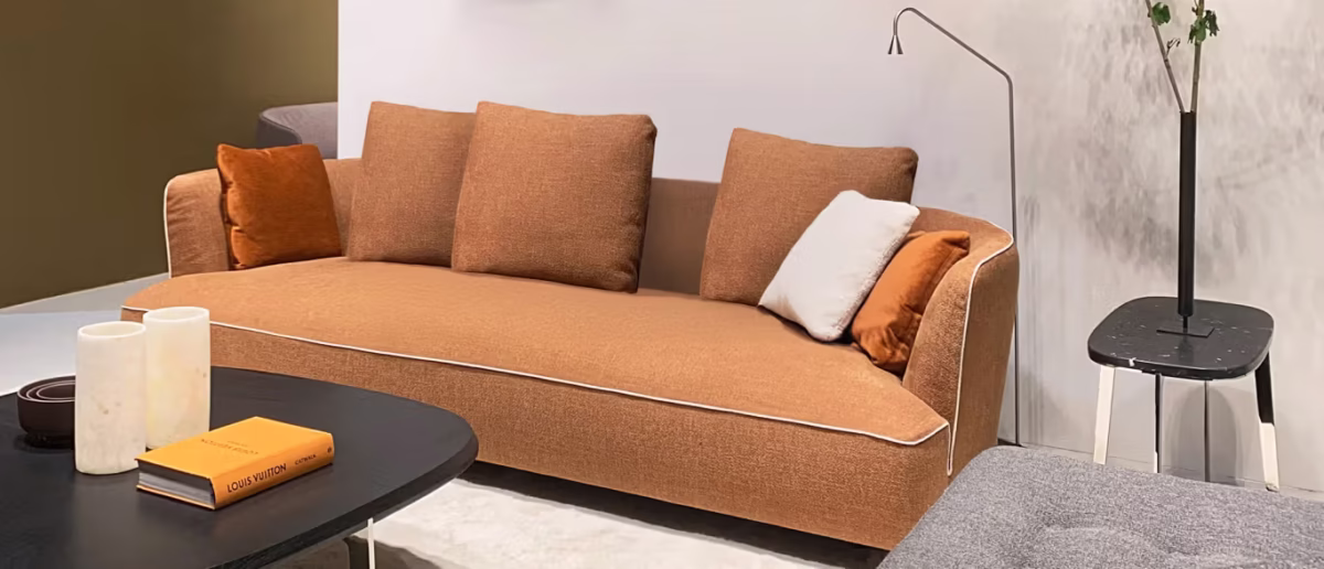 Max by Bensen lounge chair in deep blue fabric with thick cushions and wide armrests in a contemporary living room