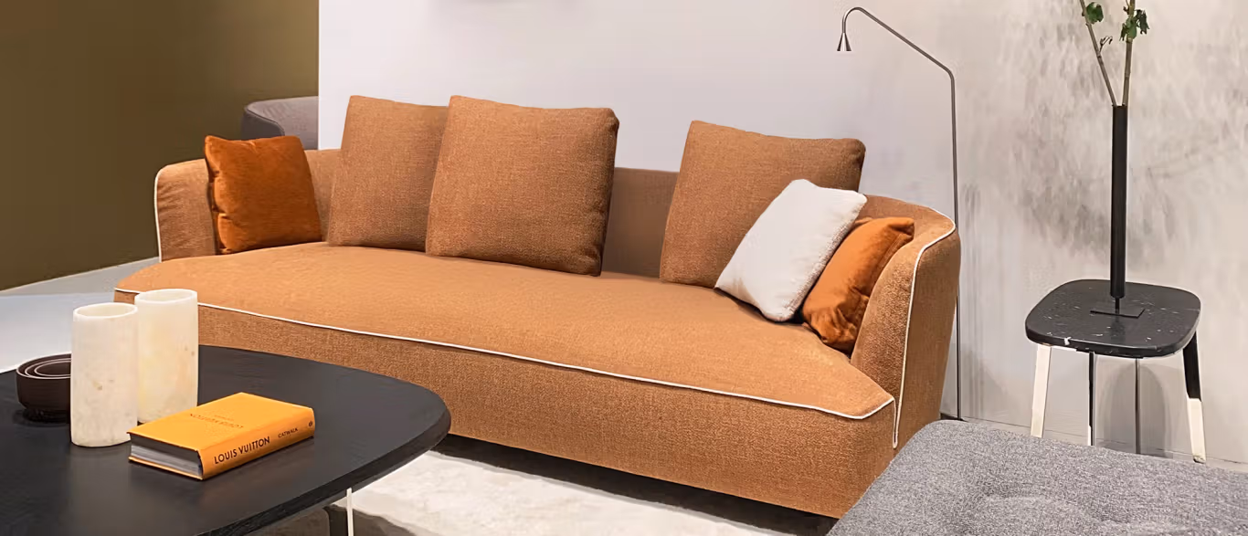 Max by Bensen lounge chair in deep blue fabric with thick cushions and wide armrests in a contemporary living room