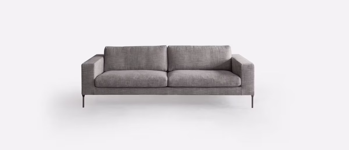 Neo by Bensen lounge chair in light gray fabric with slim black metal legs in a modern living room