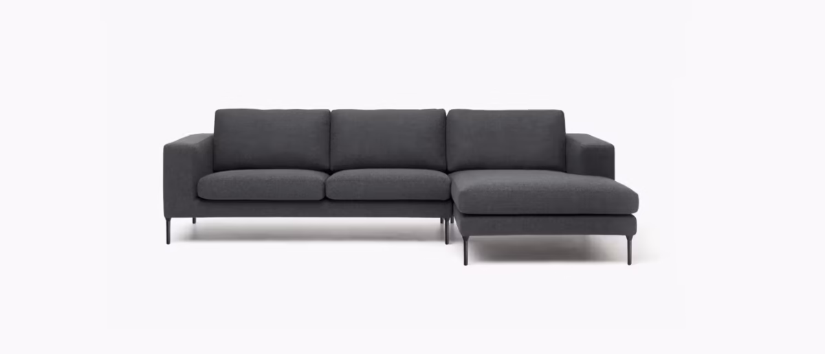 Neo Sectional by Bensen in soft gray fabric with clean lines and low-profile design in a contemporary living room