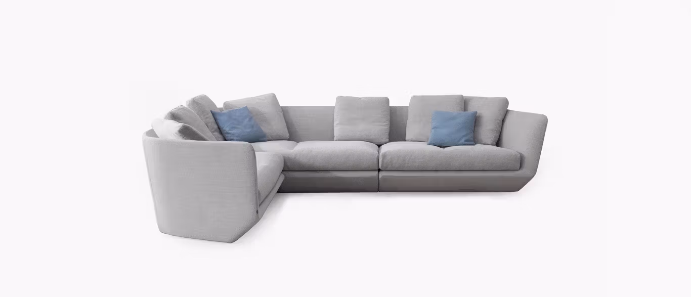Aura Sectional by Bensen in light gray fabric with deep seating and low backrest in a spacious modern living room