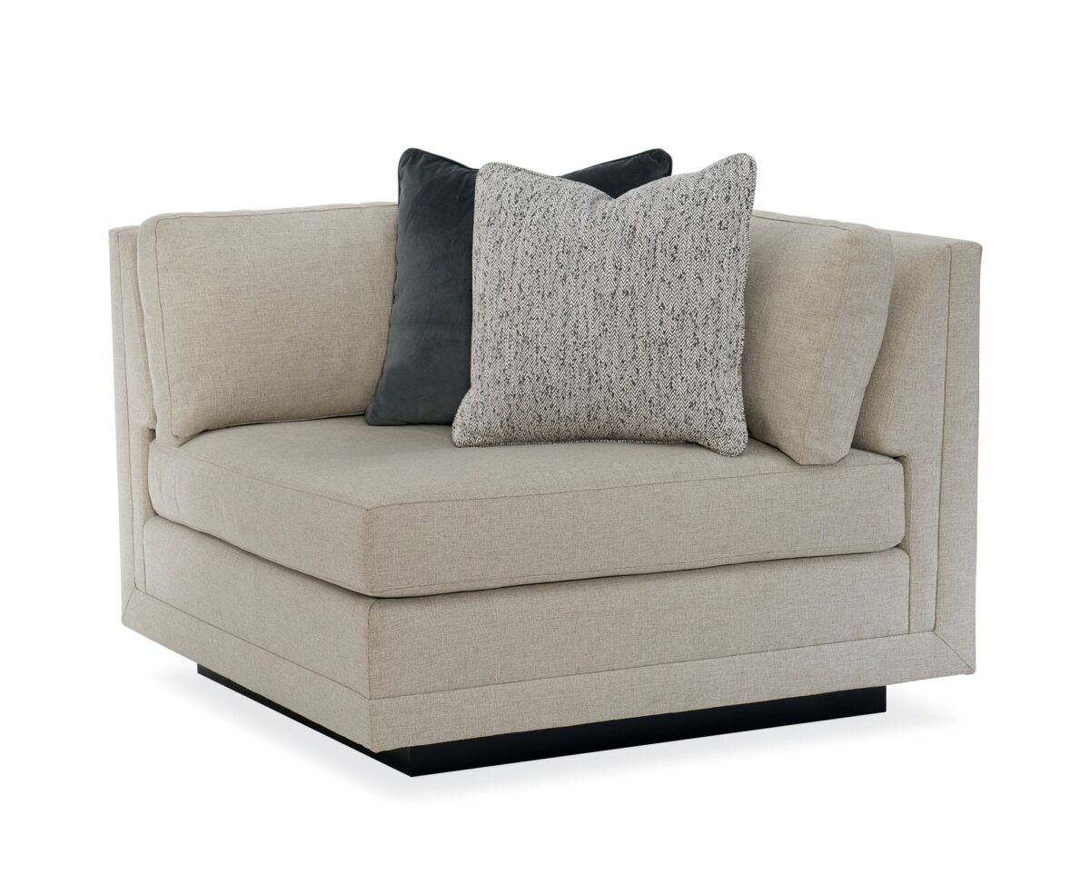 Caracole Fusion Corner Unit with neutral oatmeal upholstery, gunmetal grey velvet accents, herringbone pillows, and a recessed wood plinth base in Simply Black.