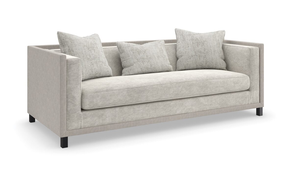 "Classic and refined Tuxedo Sofa by Caracole, featuring a sleek, structured design with plush cushions for a sophisticated and comfortable addition to any living room."