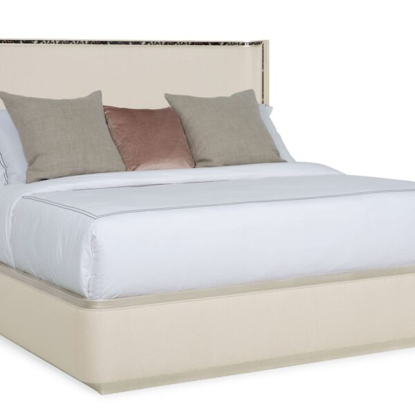 Caracole Dream Big California King Bed featuring a gently curving headboard with acrylic tortoise shell-inspired inlay, upholstered footboard and side rails in performance fabric, and a contemporary plinth base in Soft Silver Paint.