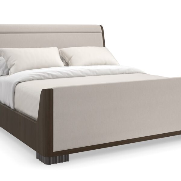 Caracole Slow Wave King Bed featuring a canted upholstered headboard and clean-lined footboard in faux slub silk, complemented by an Otter-finished footboard and side rails, and fluted Dark Chocolate legs.