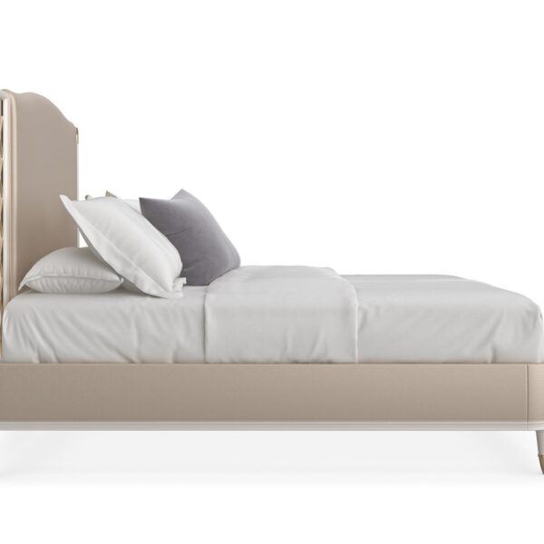 Glamorous king bed with a tall, deeply tufted headboard and mirrored or metallic accents, STAR OF THE NIGHT-King by Caracole.
