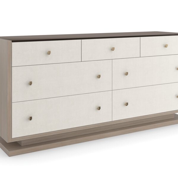 Caracole Calypso seven‑drawer dresser in Ivory Craze with Dry Martini base and brushed gold textured hardware.
