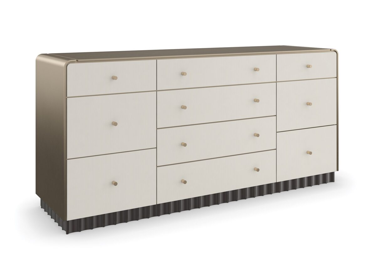 Caracole Circadian Dresser – Neoclassical-inspired 10-drawer dresser featuring micro-fluted ivory drawer fronts, a waterfall top in Whisper of Gold paint, and a contrasting Dark Chocolate scalloped base.