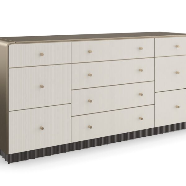 Caracole Circadian Dresser – Neoclassical-inspired 10-drawer dresser featuring micro-fluted ivory drawer fronts, a waterfall top in Whisper of Gold paint, and a contrasting Dark Chocolate scalloped base.