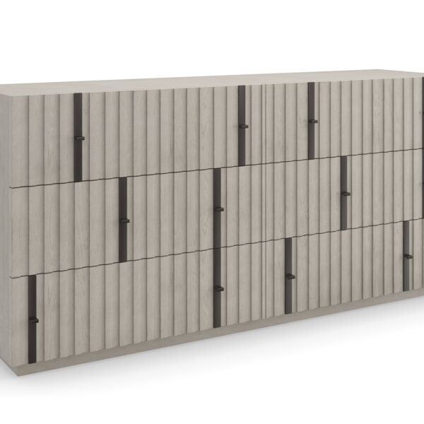 Angled shot of the Clancy Dresser showing its depth and slatted drawer fronts continuing around the side panel, contrasting the oak grain against matte-black hardware.
