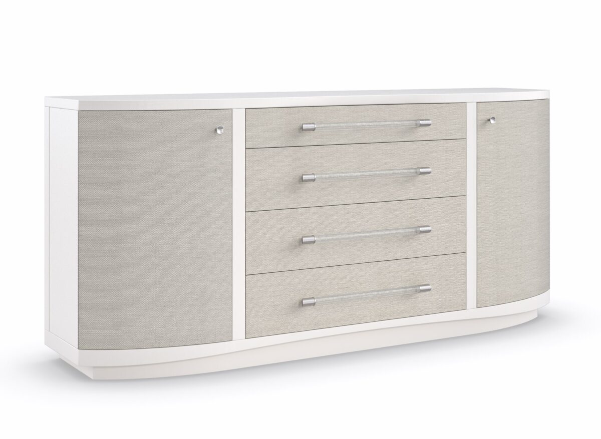 Angled shot showing the dresser’s rounded ends and seamless transition from ash veneer case to woven raffia drawer fronts.