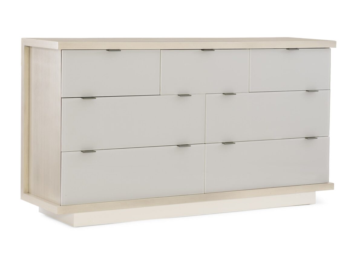Expressions Dresser by Caracole — a 66″‑wide contemporary dresser with seven back‑painted glass drawer fronts in delicate gray, set within an ash‑taupe hardwood case, featuring notched-tab pulls, soft‑close undermount guides, a low plinth base, and USB ports integrated on both sides.