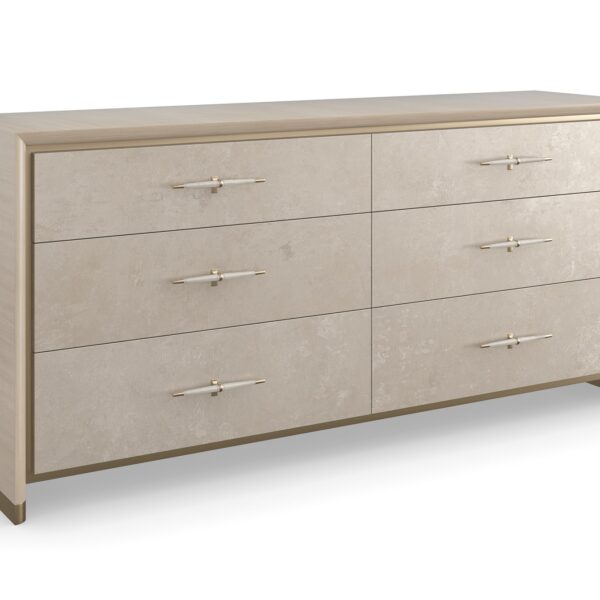 Hang Up Dresser by Caracole — a 70‑inch wide classic dresser with six drawers featuring metallic leaf-finish fronts that shimmer like frosted glass, set in a Dry Martini-finished hardwood frame with recessed metal trim, tapered faux‑leather-wrapped pulls in brushed gold and nickel, soft‑close drawers, and linen-painted interior with top drawer dividers and a removable jewelry tray.