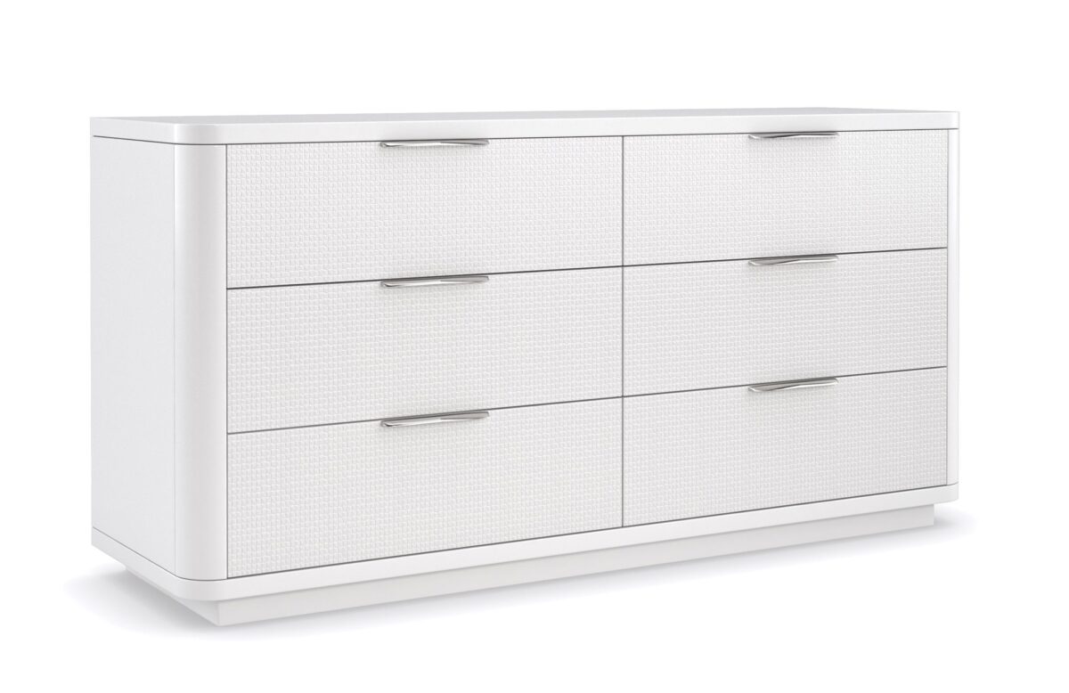Loving Touch Dresser by Caracole — a 64″‑wide six‑drawer dresser in Cloud White finish, with gently rounded edges, carved drawer fronts featuring a woven mini‑tile motif, clean finger‑cup pulls, and undermount soft‑close guides.