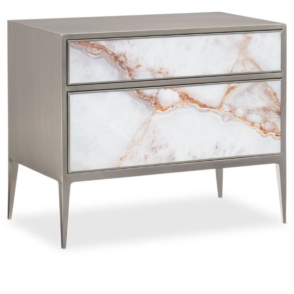 A Real Gem nightstand by Caracole — a 34″‑wide brushed‑nickel metal‐framed chest with two touch‑latch glass drawers painted in agate pattern, slim tapered legs, and a luminous pearl‑painted interior.