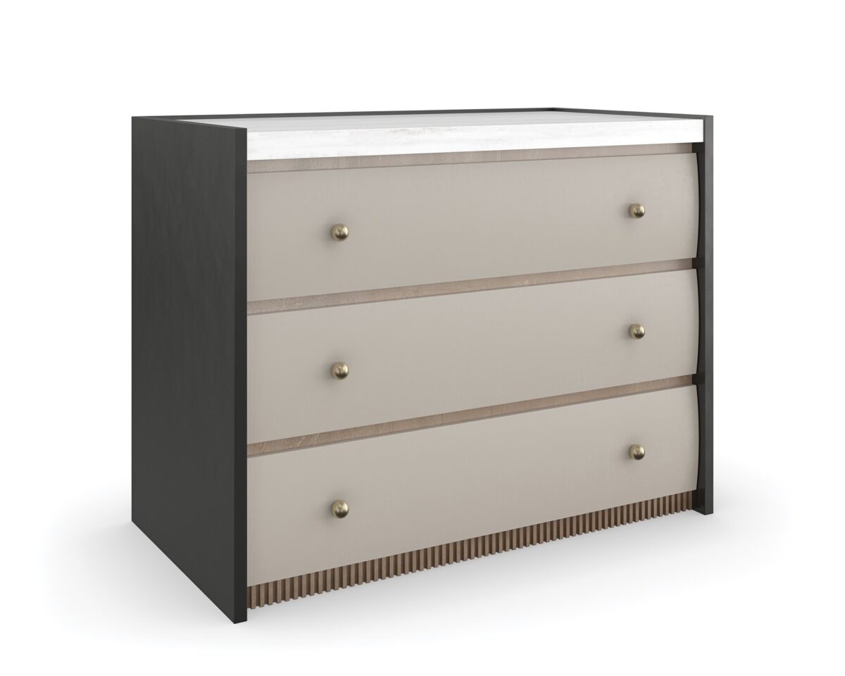 Avignon Bronze Nightstand by Caracole — a 34″‑wide classic nightstand with three soft‑close drawers featuring tactile Rockport Burnished Adobe fronts, set within Craftsman Bronze‑painted end panels; topped with striated white Guangxi stone, trimmed with antique‑bronze‑leaf dentil molding at the base, brushed‑gold ball knobs, and painted Almond Milk interiors.