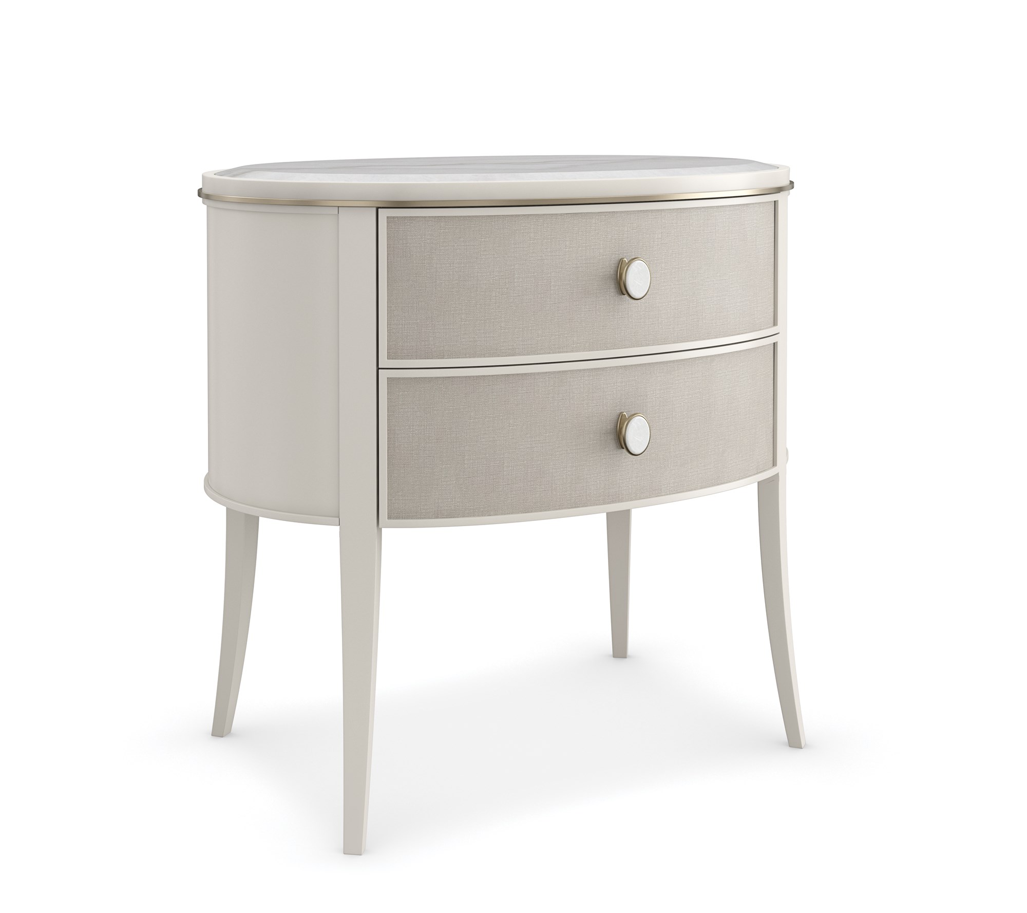 Bruges Nightstand by Caracole — a 28″‑wide oval bedside chest featuring a beveled Guangxi marble top, two vinyl‑wrapped drawers with linen-like texture and brushed‑gold metal bead inlay, set in an Almond Milk painted acacia wood case with jewelry-style round pulls, soft‑close undermount guides, and Almond Milk–painted interiors.