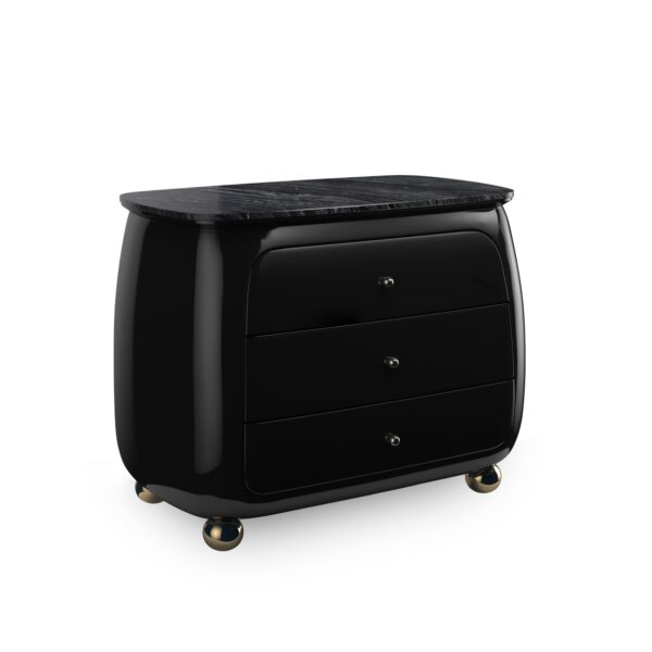 Cabochon Nightstand by Caracole — a 34″‑wide sculptural nightstand with a rounded Piano Black resin frame, featuring a flat Tree Black stone top with natural black and grey veining; three curved drawers with soft-close undermount guides and Piano Black interiors; Whisper of Gold spherical metal knobs and matching ball feet complete the luxurious design.