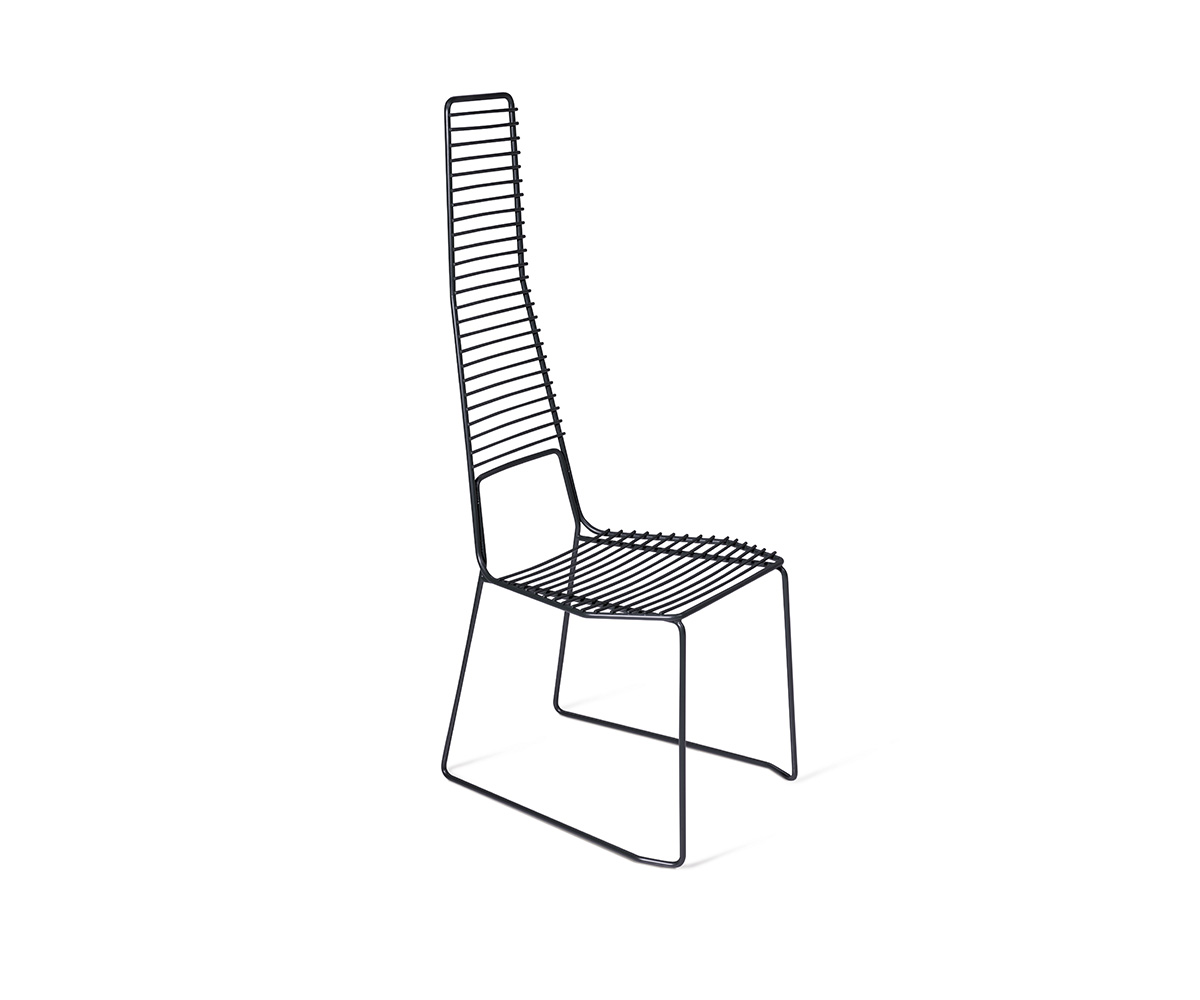 "Alieno Chair by Casamania in black painted metal with a minimalist sled base, highlighting its sleek structure, high backrest, and textured finish, set in a modern outdoor patio."