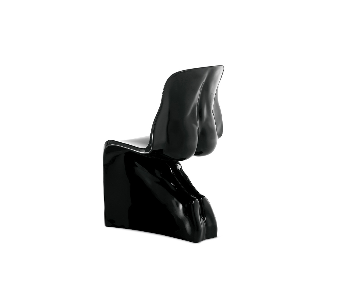 "Him Glossy chair by Casamania, designed by Fabio Novembre, featuring a sculpted male form in glossy painted polyethylene, inspired by the Panton Chair, suitable for both indoor and outdoor use."