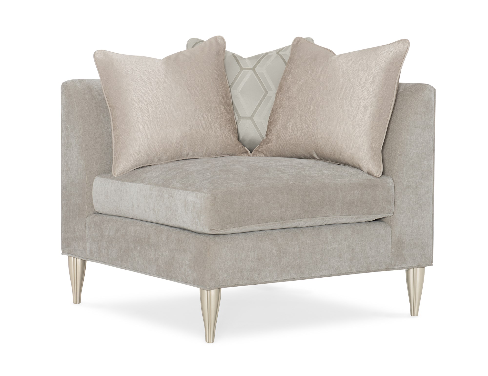 Caracole Fret Knot Corner featuring a carved fret panel inspired by a narrow castle window, Soft Silver Paint finish, fluted conical legs, and a supportive eight-way hand-tied seat.