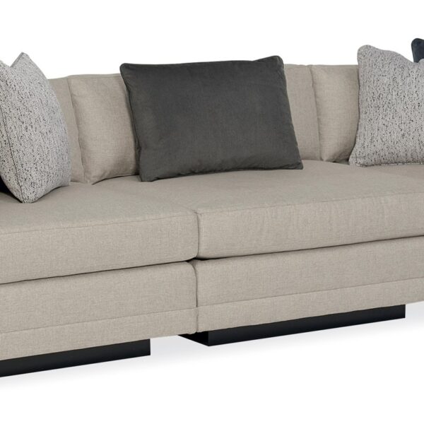 Caracole Fusion 3 Piece Sectional featuring a neutral, menswear-inspired textured tweed pattern, recessed Simply Black wood plinth base, cut-out frame detailing, and contrasting accent pillows in gunmetal velvet and black-and-white herringbone stitch.