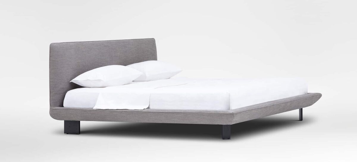 Modern platform bed with slim frame and padded headboard by Camerich.